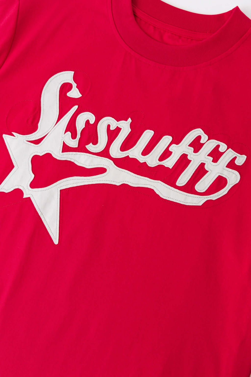 Red t-shirt with white SSSTUFFF logo and a star
