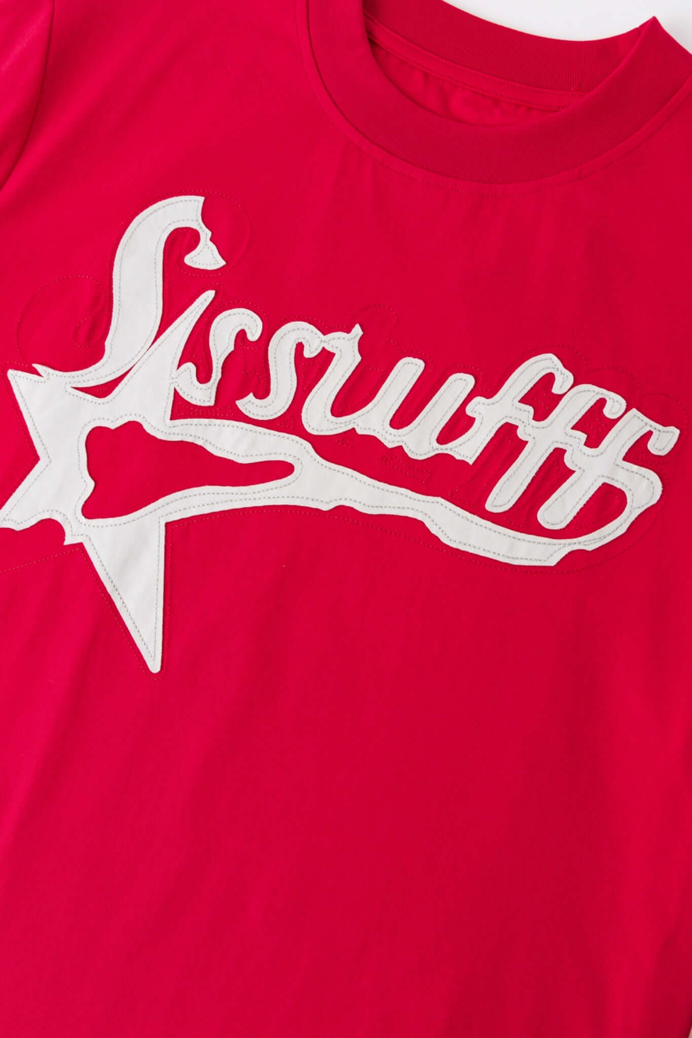 Red t-shirt with white SSSTUFFF logo and a star
