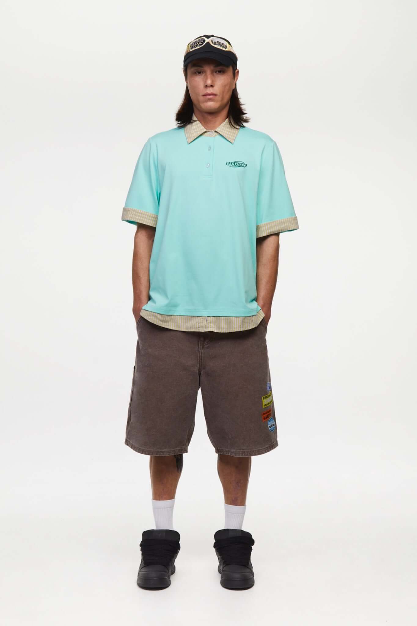 Turquoise polo shirt with checkered collar and sleeves