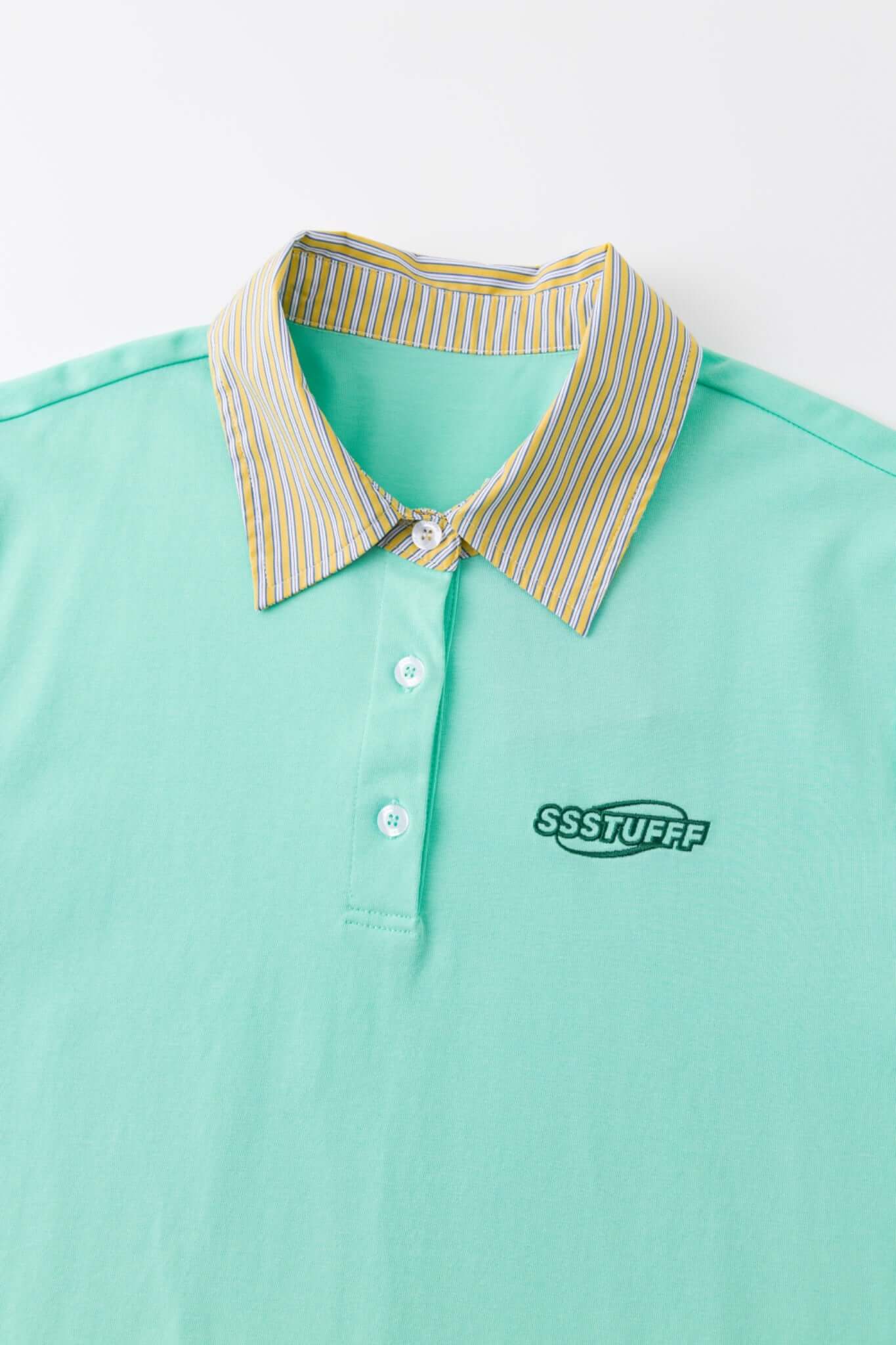 Turquoise polo shirt with checkered collar and sleeves