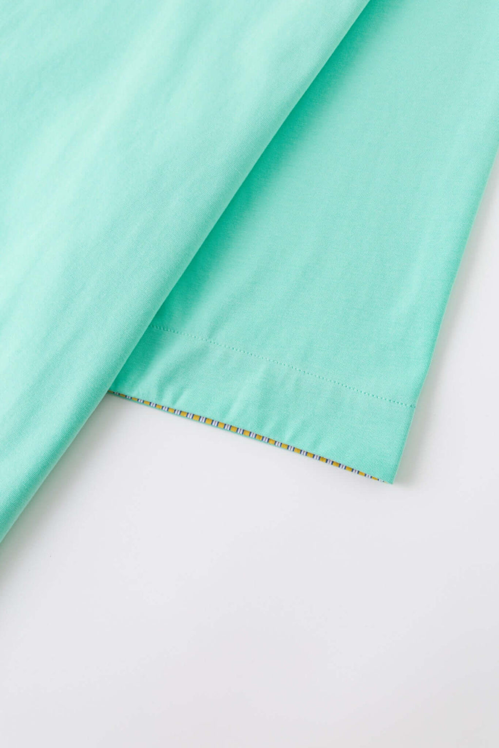 Turquoise polo shirt with checkered collar and sleeves