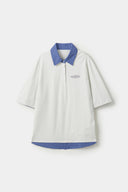 White polo shirt with checkered collar and sleeves
