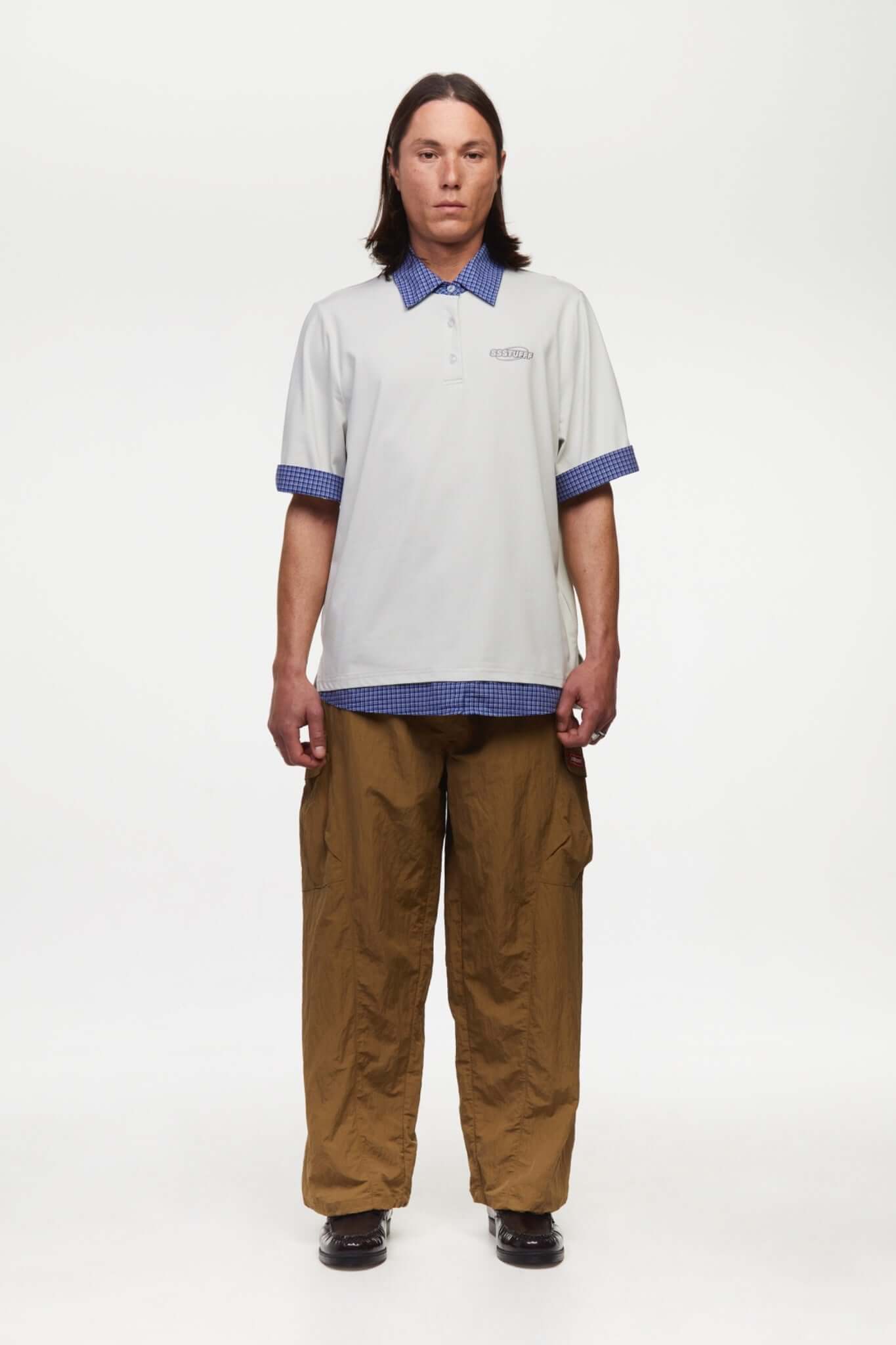 White polo shirt with checkered collar and sleeves
