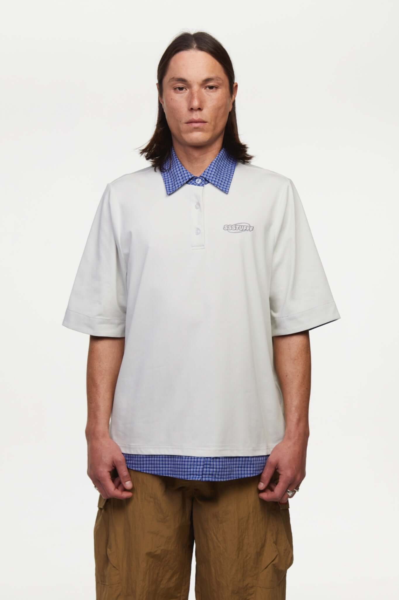 White polo shirt with checkered collar and sleeves
