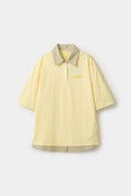 Yellow polo shirt with checkered collar and sleeves
