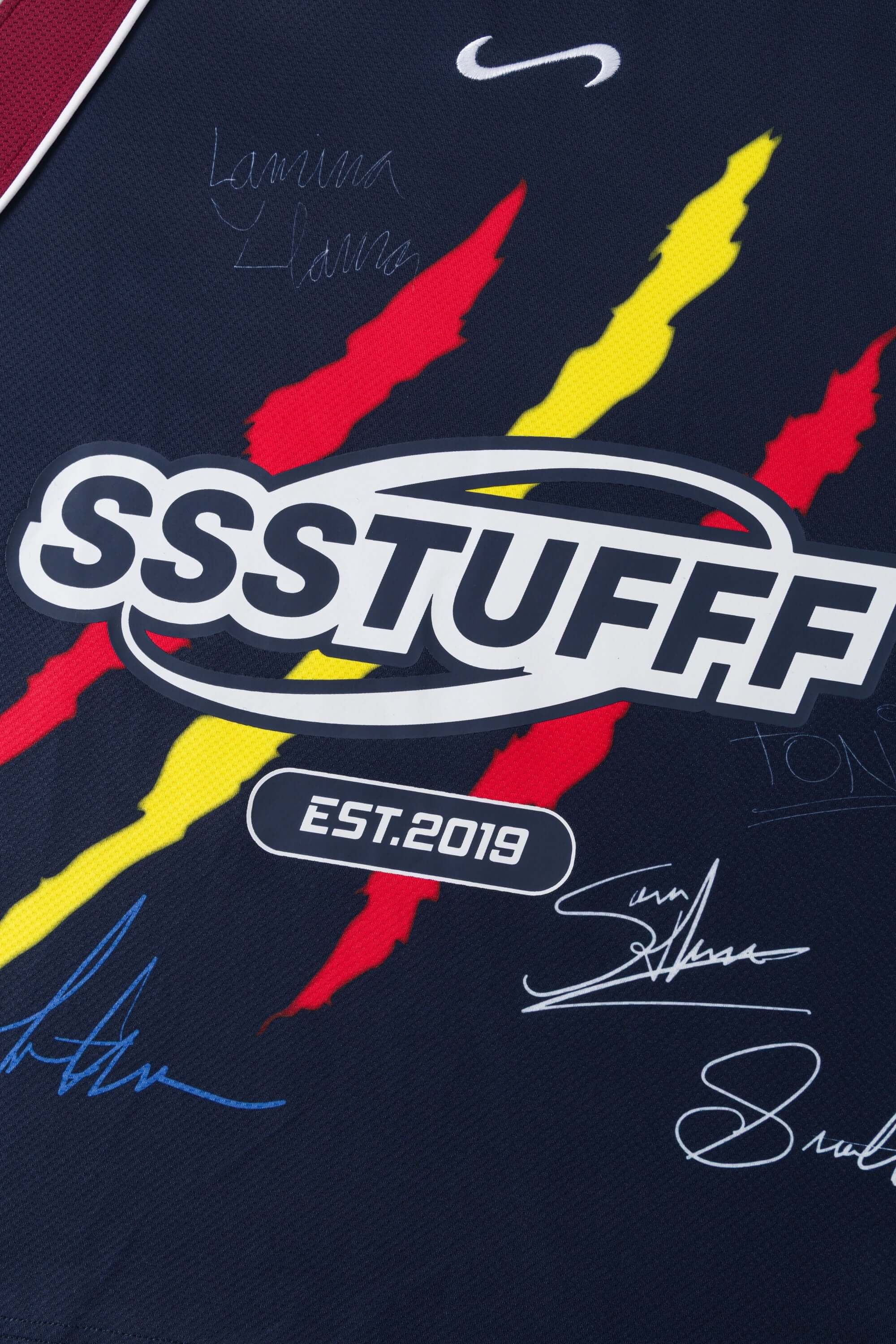Navy blue sports jersey signed with colorful graphics and 'SSSTUFFF' branding