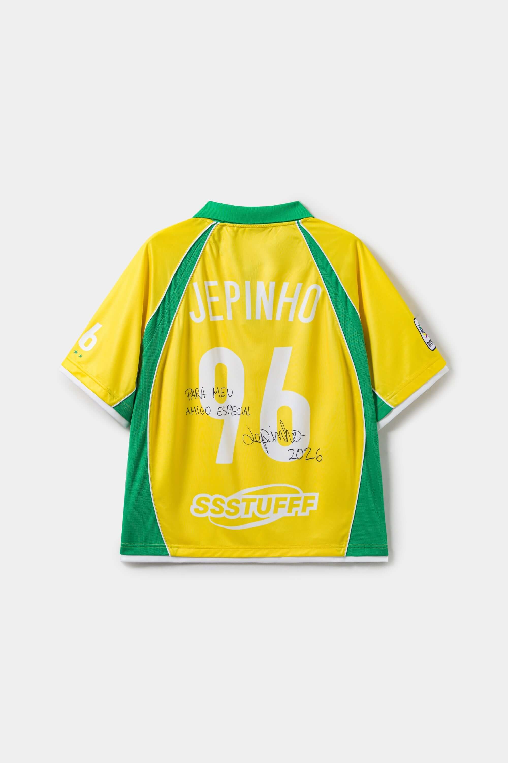 Yellow and green sports jersey with 'Jepinho' and '96' signed on a white background