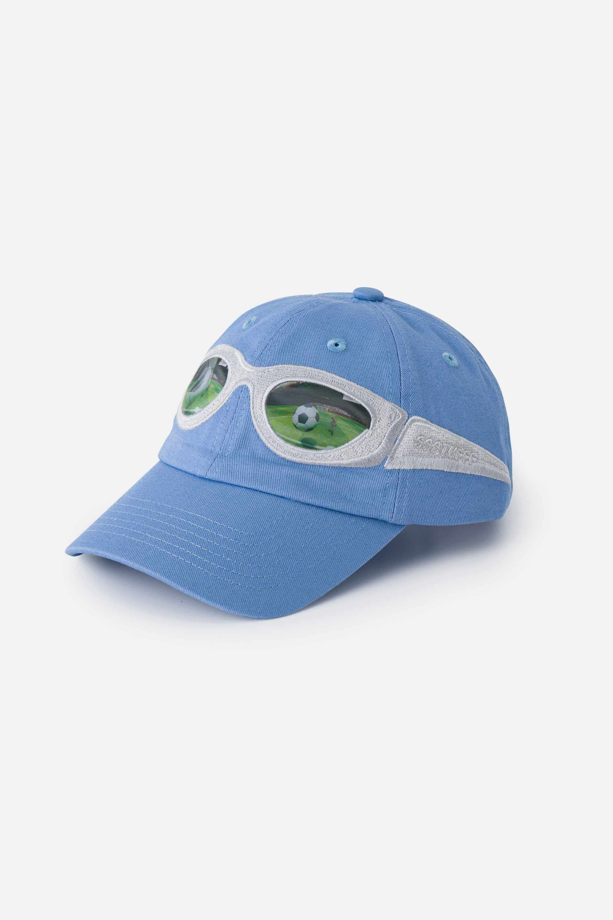 Light blue cap with silver sunglasses design on a white background. The lens of the glasses has a lenticular effect with a football ball inside a goal