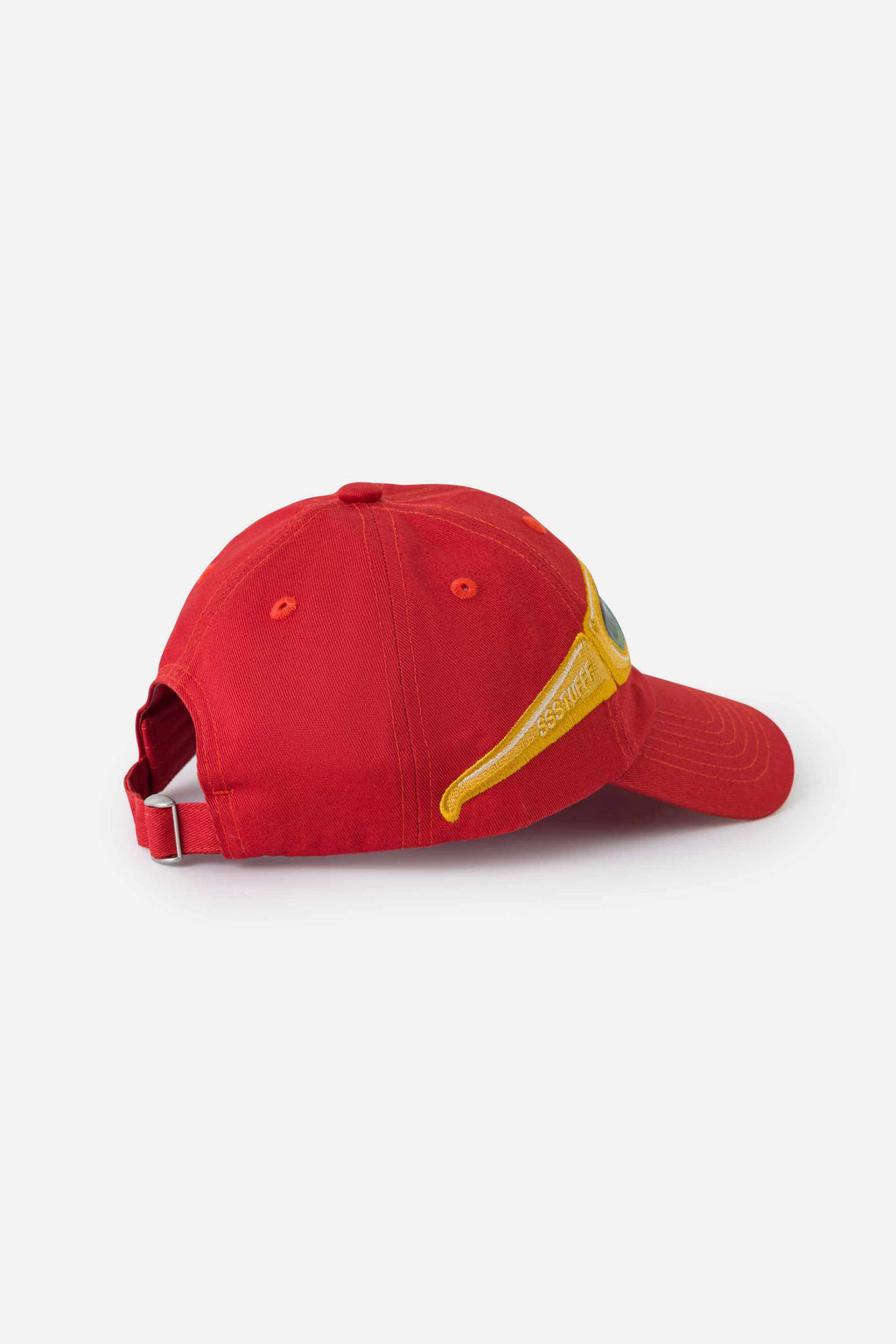 Back of a red cap with yellow sunglasses on a white background