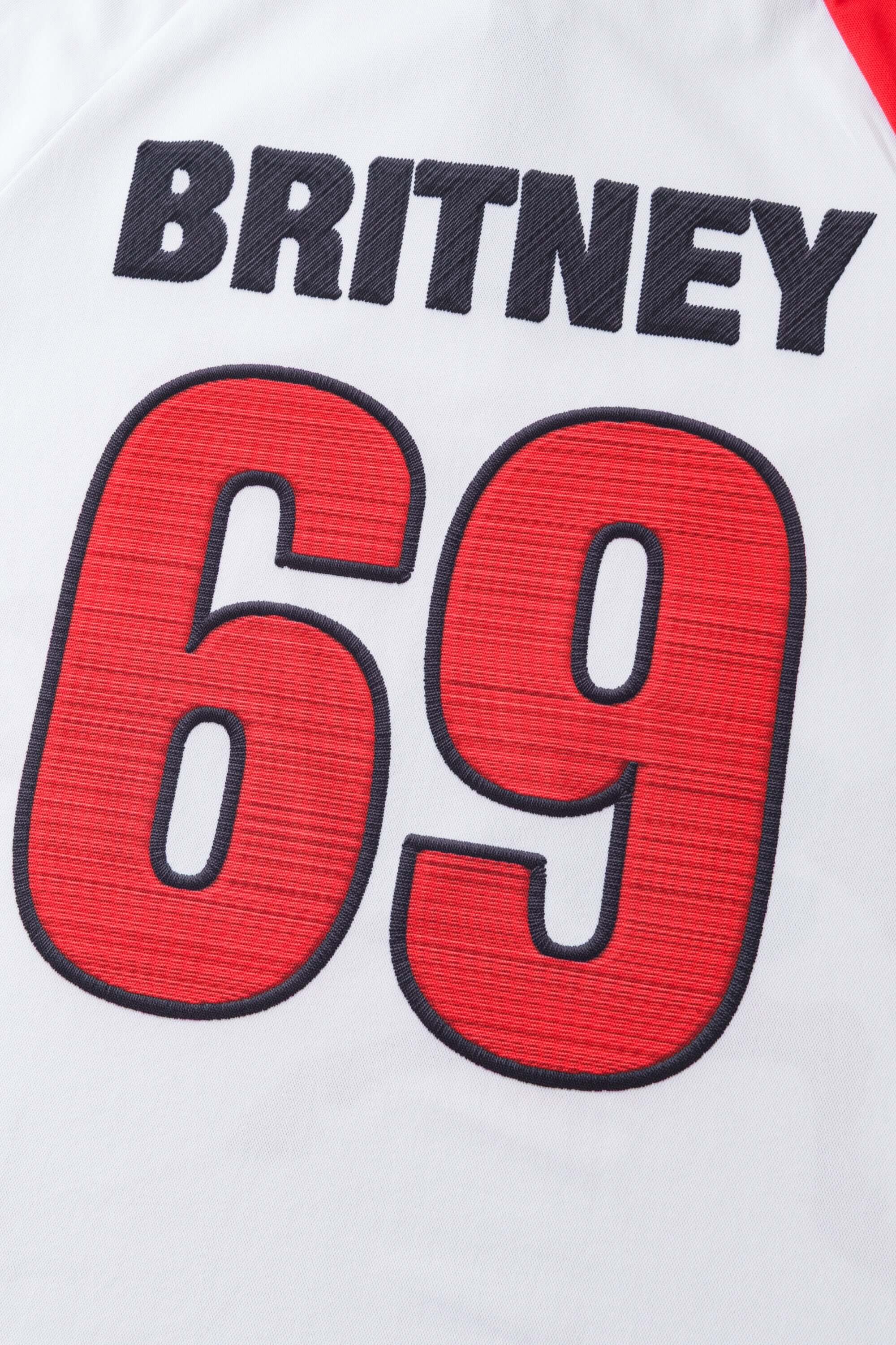 White jersey with 'BRITNEY' and '69' printed on it mimicking embroidery