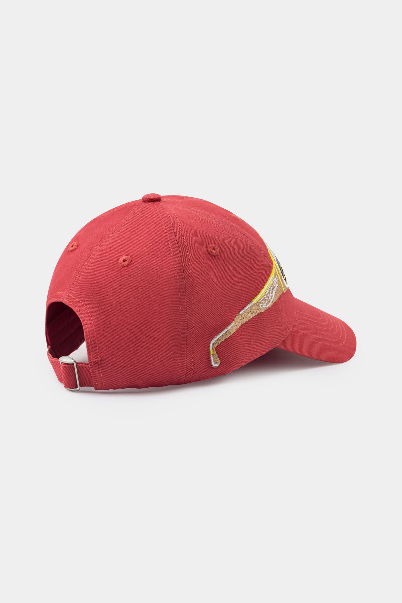 Red cap with a embroidery glasses on it, seeing a city on them.