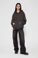 Leopard print zip up with a red label on a light gray background