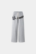 Gray wide-leg pants with a walkman belt on a grey background
