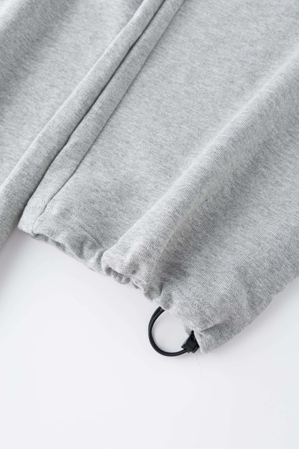 Gray wide-leg pants with a walkman belt on a grey background