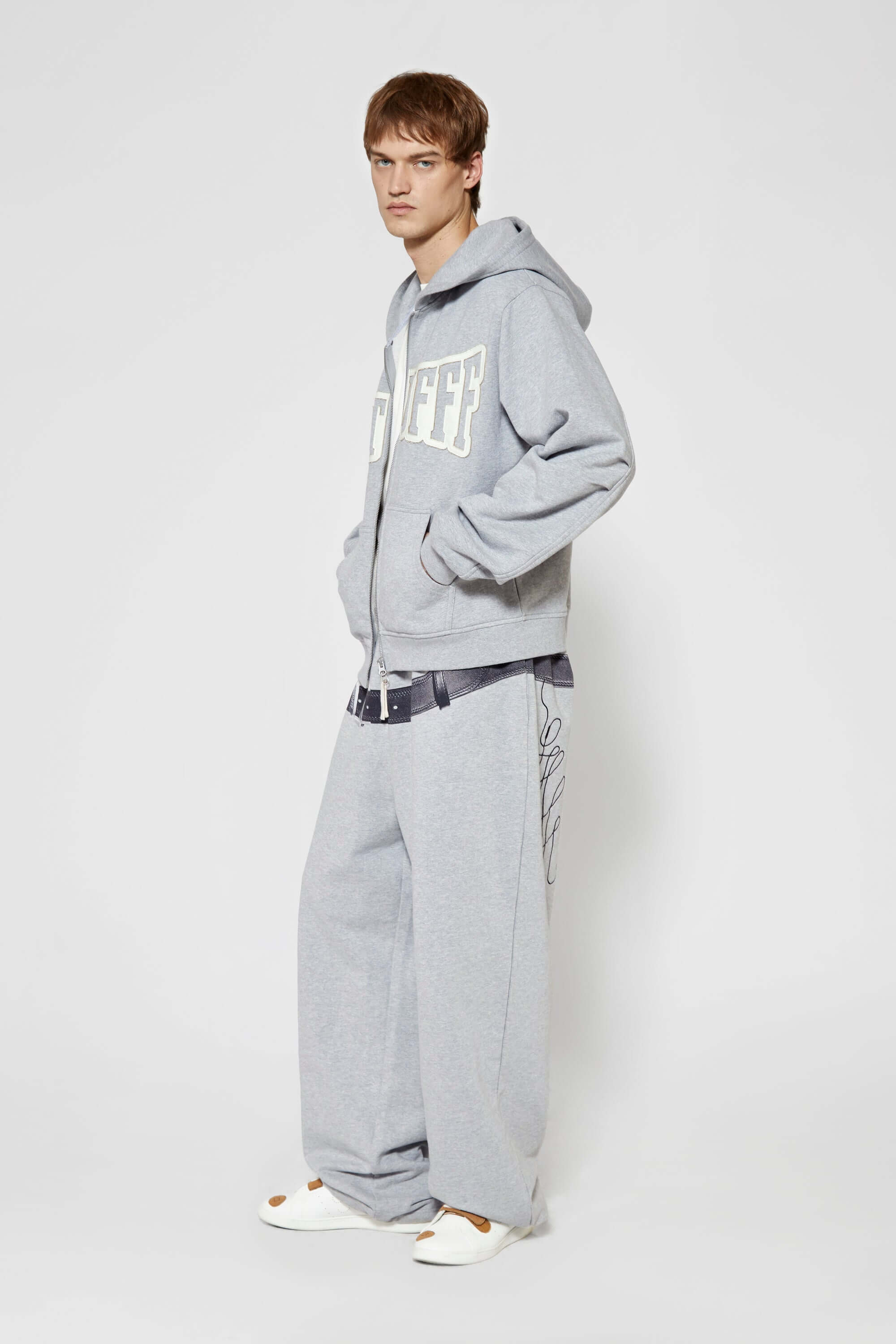 Gray hoodie with 'SSSTUFF' that changed color with UV light