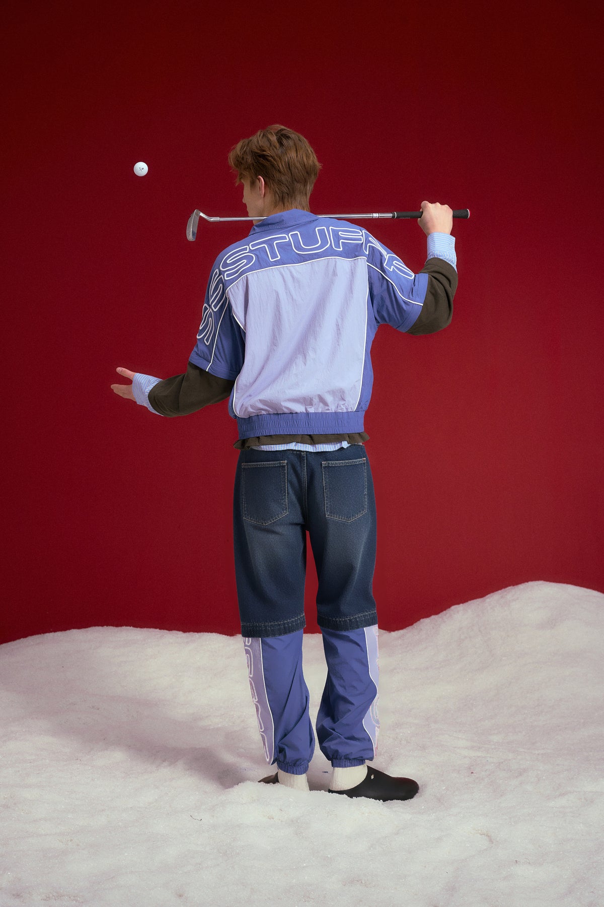 3 in 1 Detachable Layered Track Top in periwinkle blue, with sleeves and layers that zip off into three pieces. Worn on a model, full-length back view.