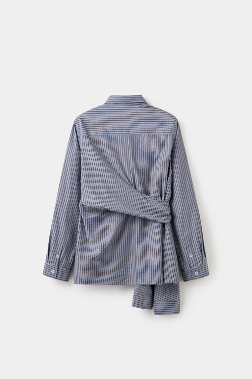 Back view of the striped four-sleeve shirt, with the spare sleeves hanging loose.