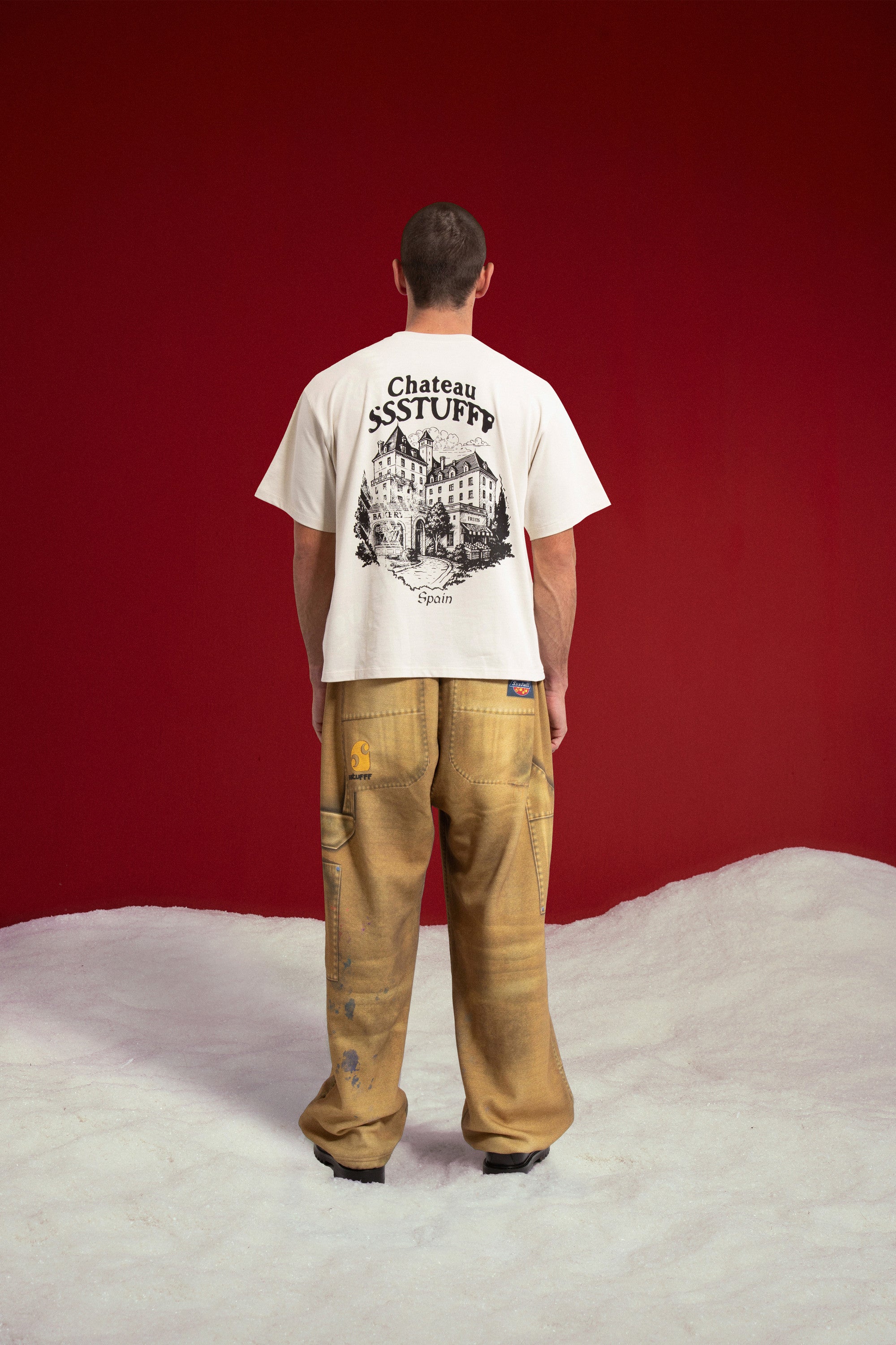 Model seen from behind wearing the Chateau SSSTUFFF UV Clues Tee.