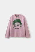 Cut My Hair Knit in pink, a crewneck knitted with a wide-eyed character whose green fringe is hand-knotted and can be cut.