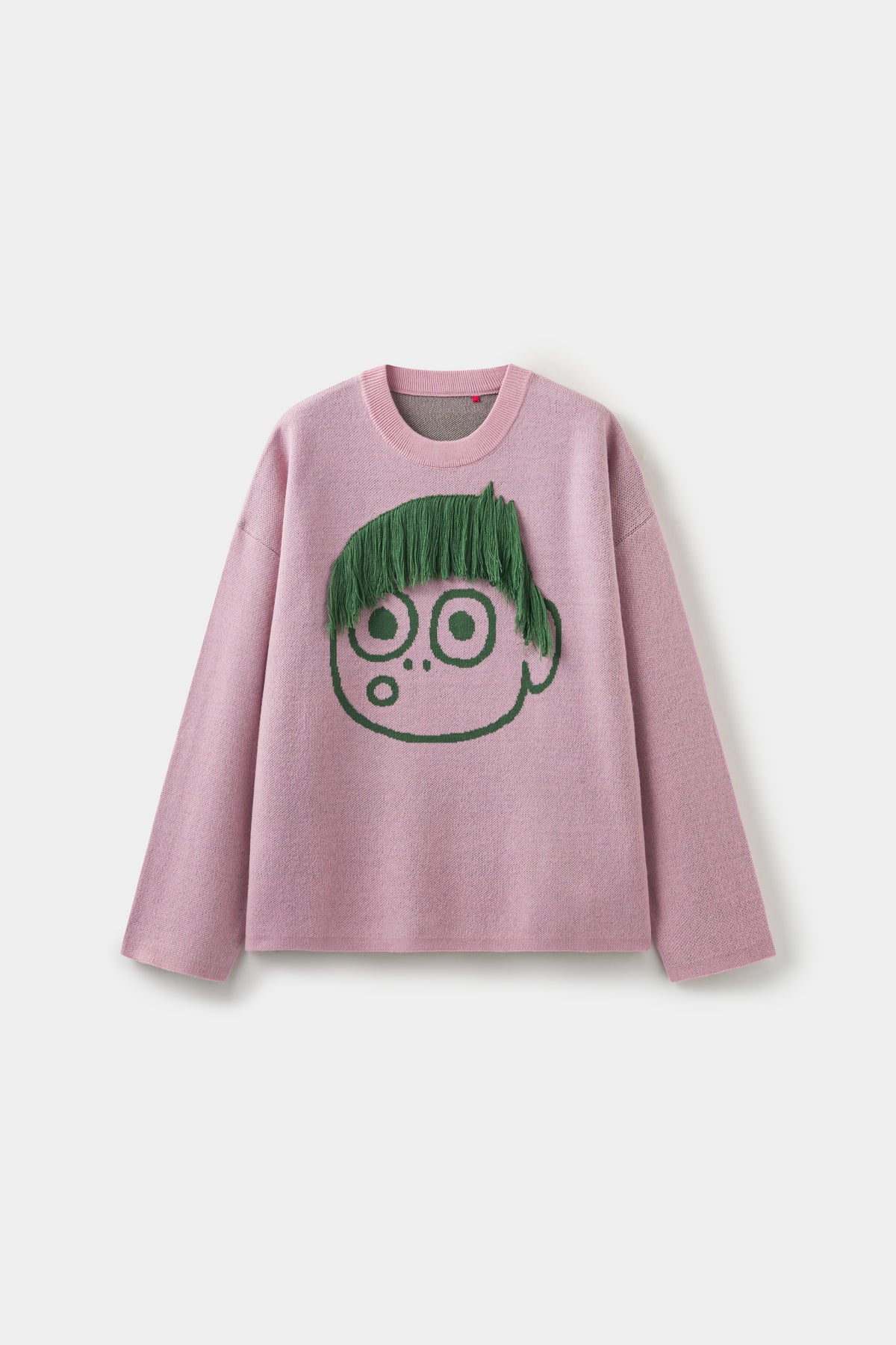 Cut My Hair Knit in pink, a crewneck knitted with a wide-eyed character whose green fringe is hand-knotted and can be cut.