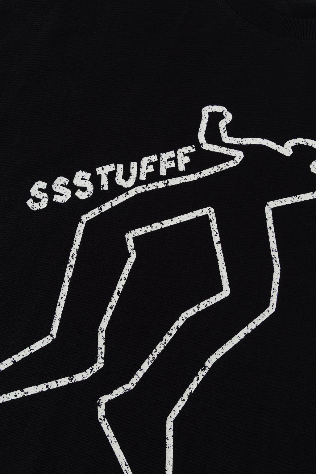 Close-up of the white chalk outline print in daylight.