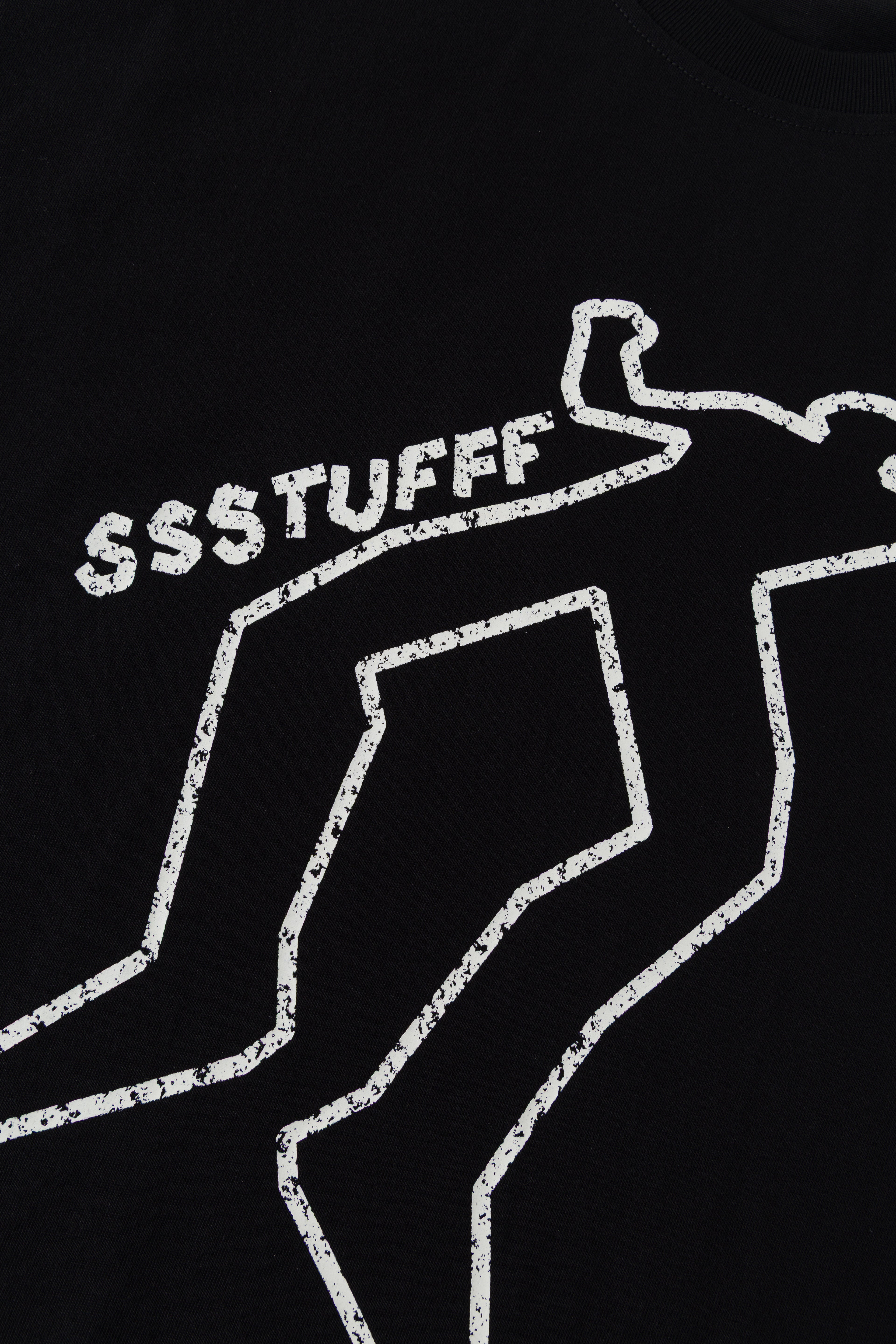 Close-up of the white chalk outline print in daylight.