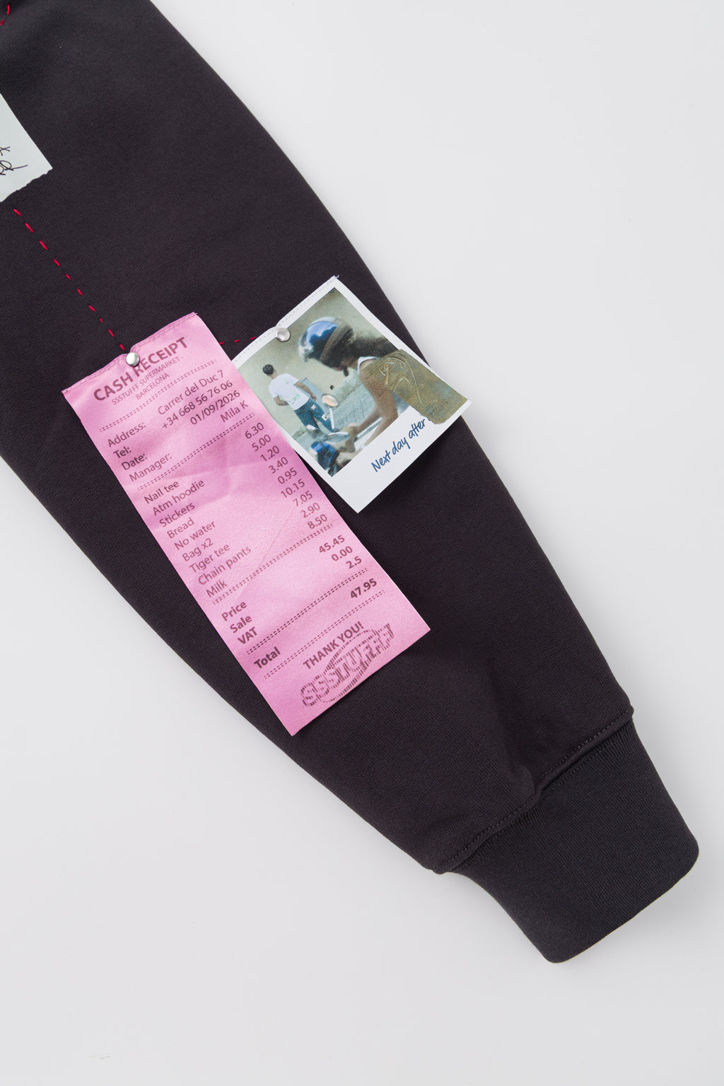 Detail of the printed receipt and photograph on the sleeve.