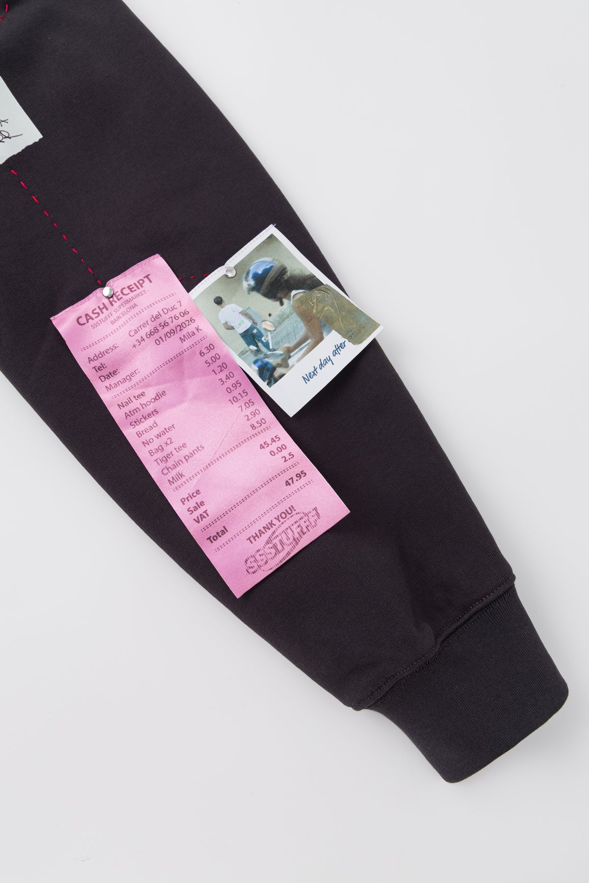 Detail of the printed receipt and photograph on the sleeve.