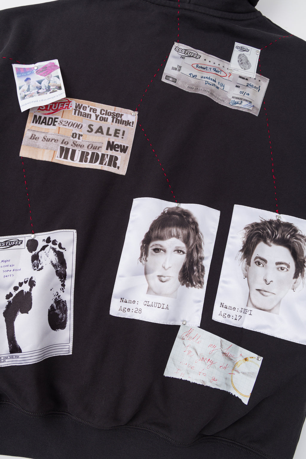 Close-up of the newspaper clipping and portraits on the back.