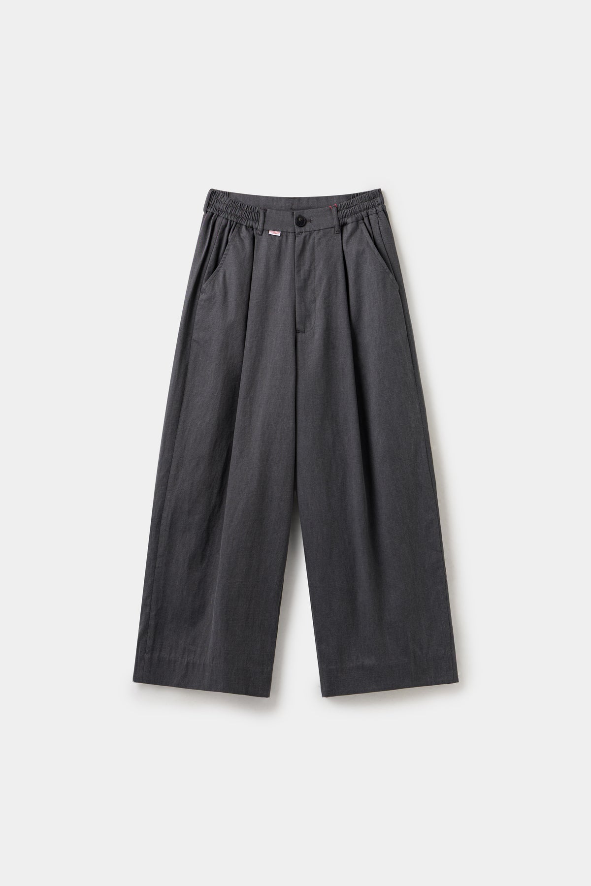 Dress Pants in black, cut as an oversized pleated wide leg trouser.