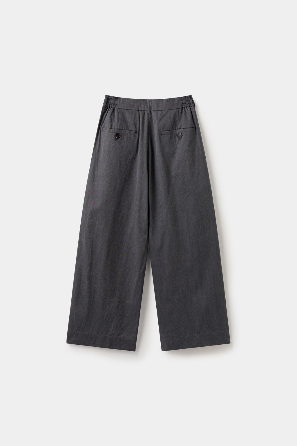 Back view of the black wide leg dress pants, with a buttoned welt pocket.