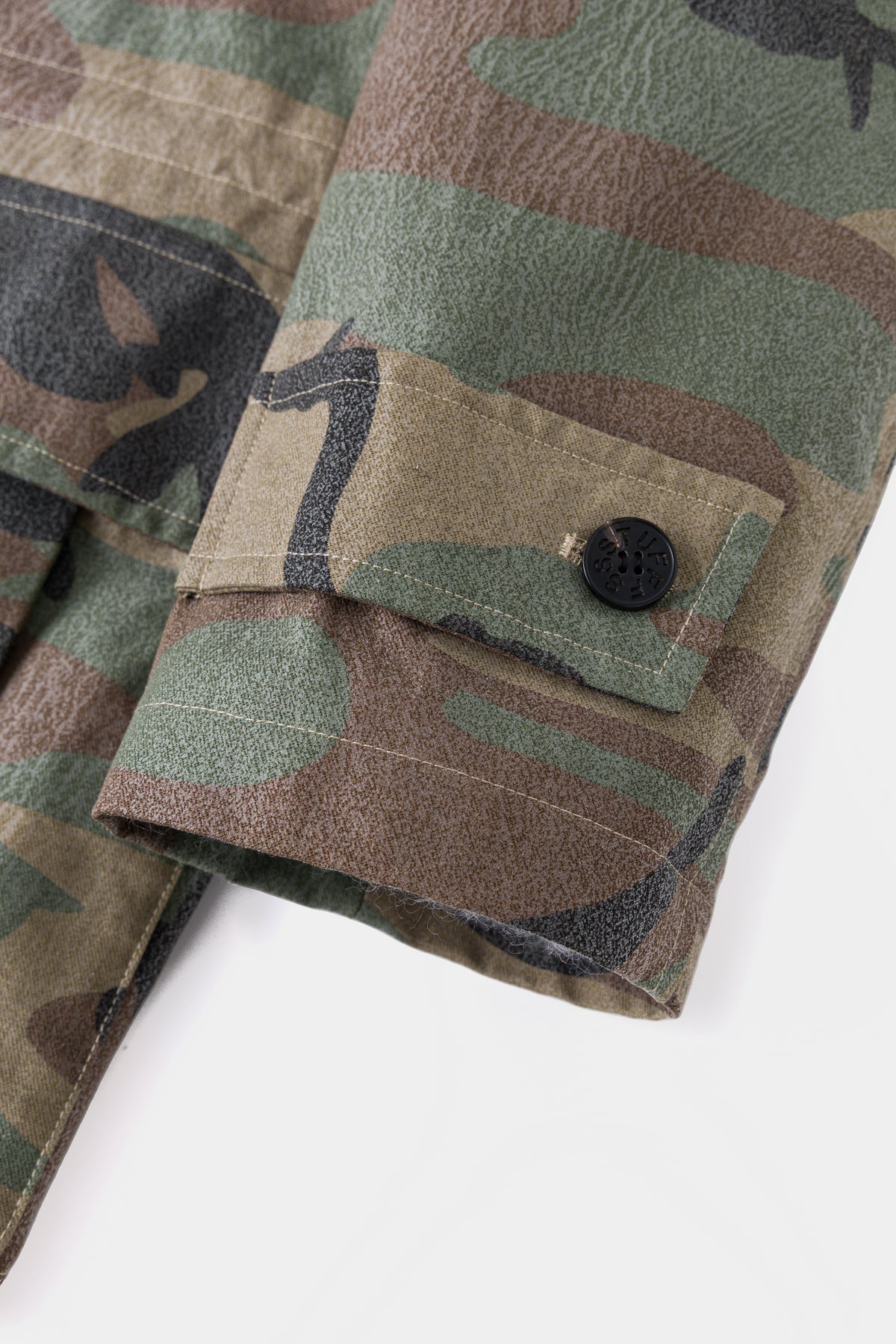 Close-up of the cuff and its buttoned adjuster tab.