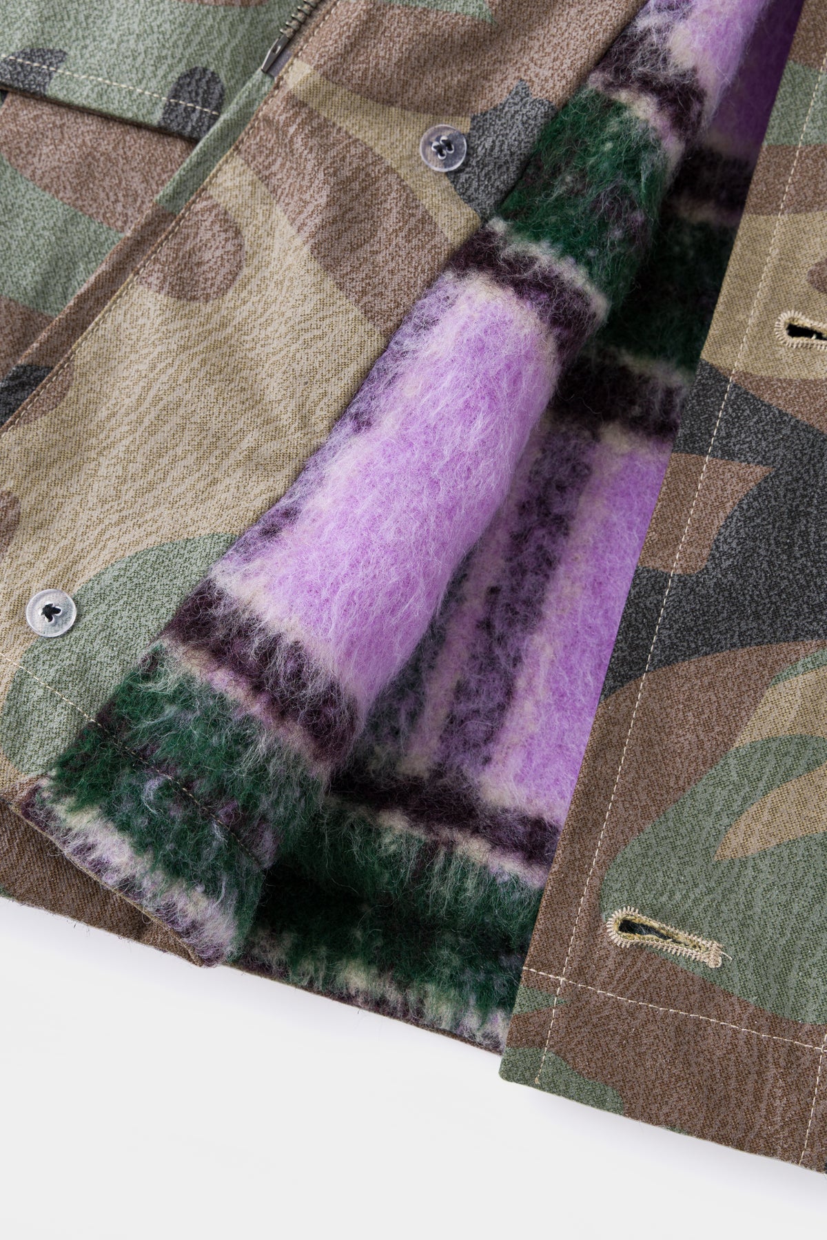 Detail of the purple and green faux fur lining inside the parka.