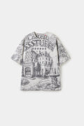 AOP Print Postcard Tee in off-white, printed edge to edge with the Château SSSTUFFF hotel postcard artwork.