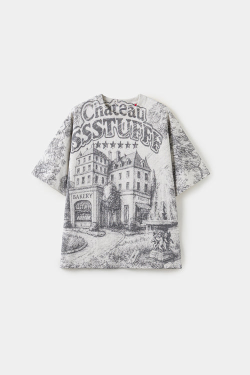 AOP Print Postcard Tee in off-white, printed edge to edge with the Château SSSTUFFF hotel postcard artwork.