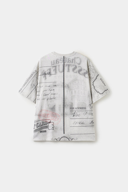 Back view of the postcard tee, printed as the address side of the card with handwriting and a POST CARD stamp.