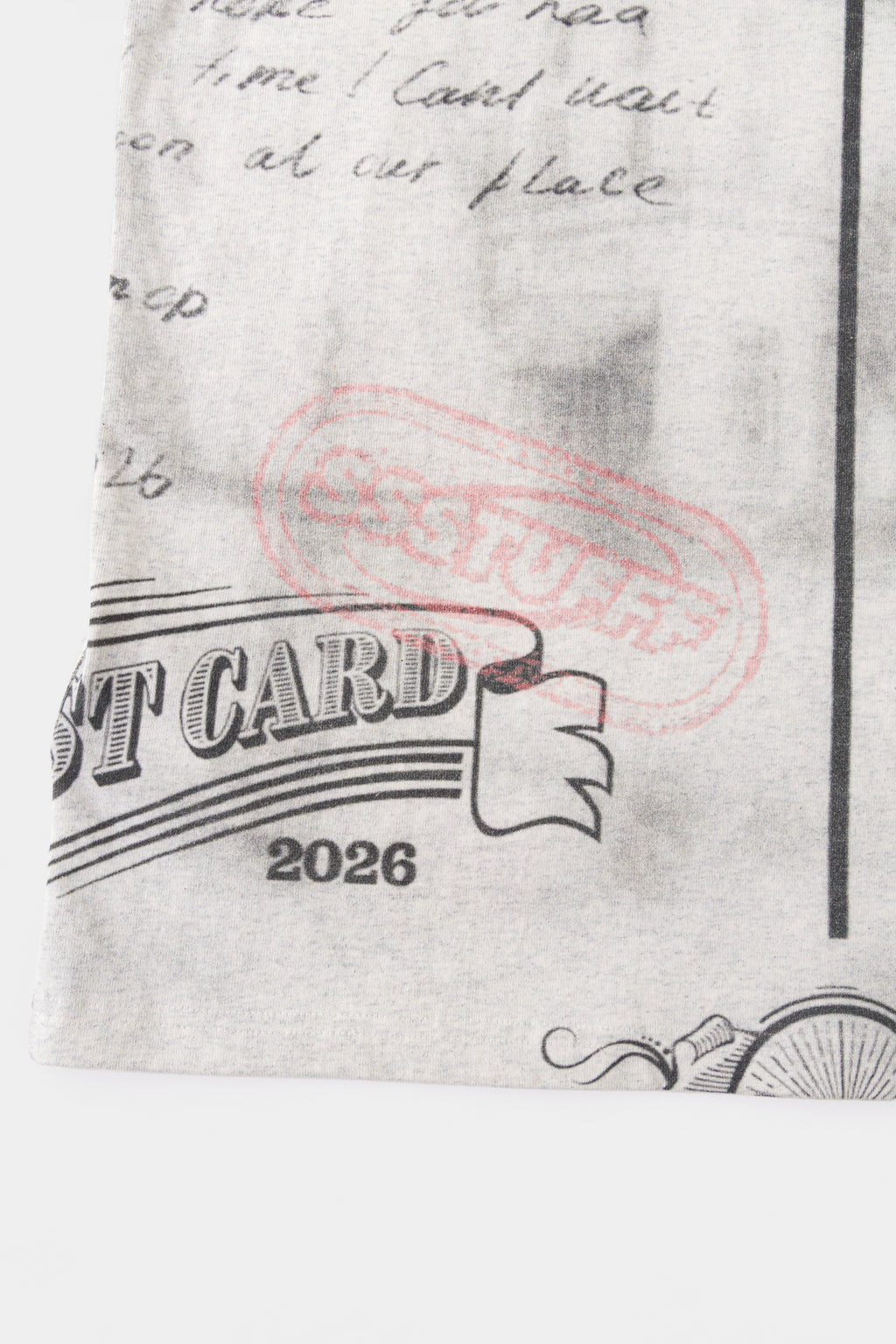 Detail of the pink SSSTUFFF postmark over the POST CARD 2026 stamp on the back.