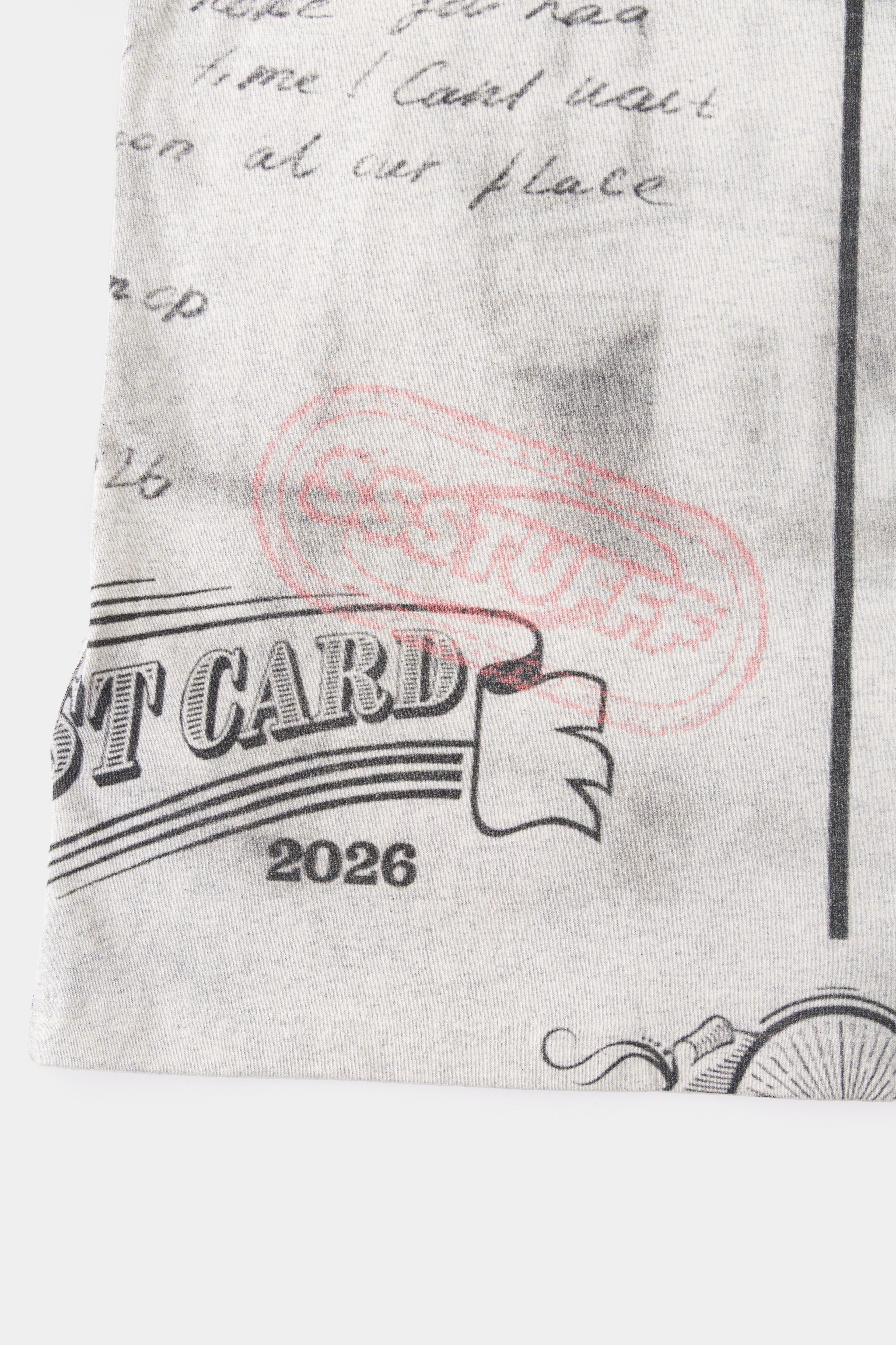 Detail of the pink SSSTUFFF postmark over the POST CARD 2026 stamp on the back.