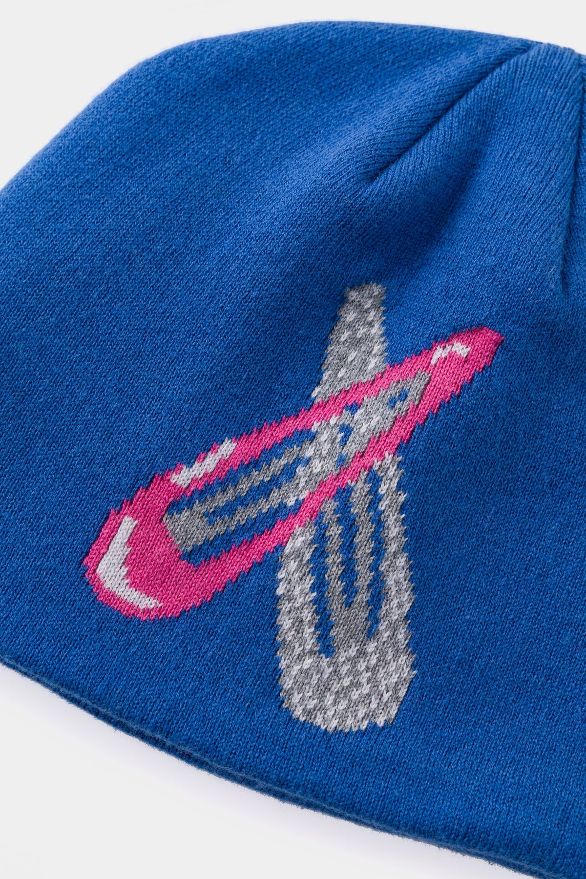 Detail of the pink clip, knitted large enough to read as the real thing.