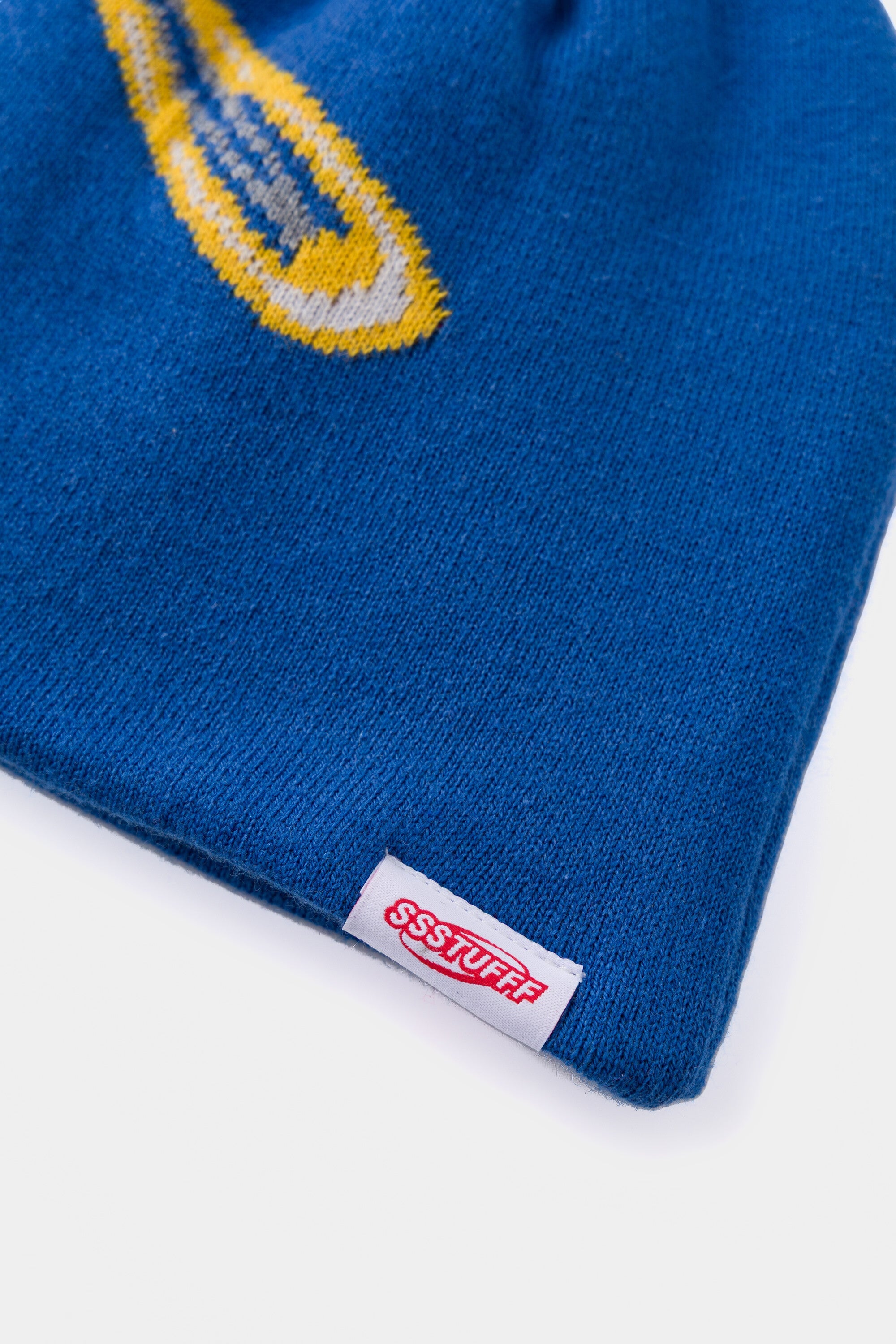 Detail of the yellow clip and the red Ssstufff label stitched at the hem.