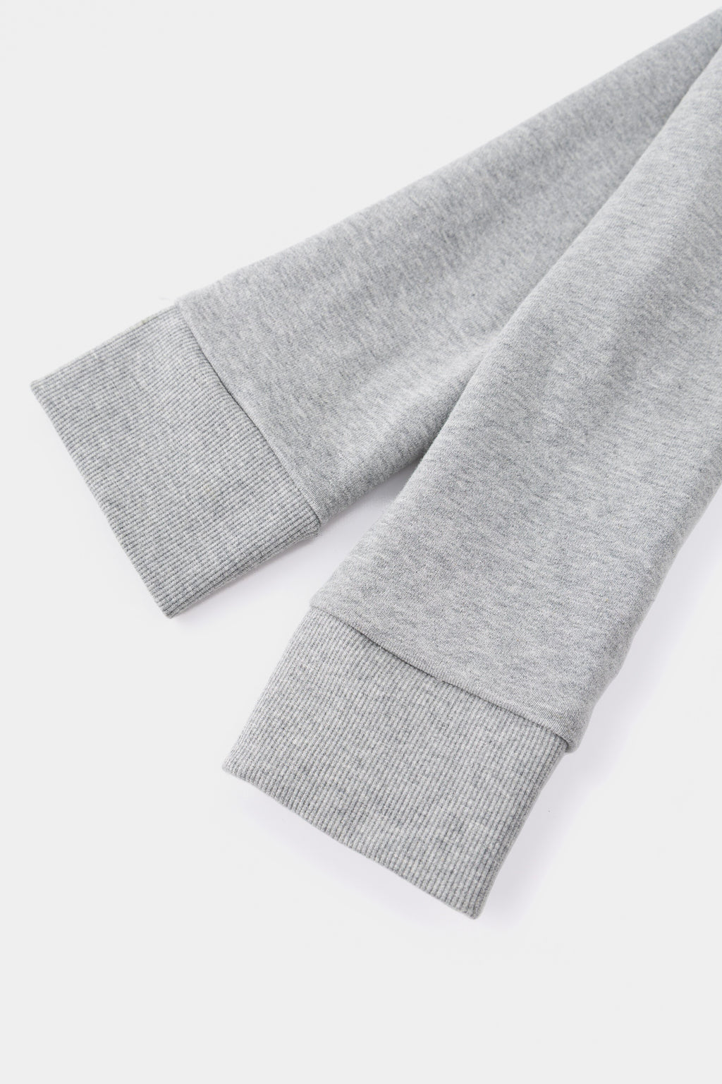 Close-up of the two ribbed cuffs where the sleeves are knotted together to form the strap.