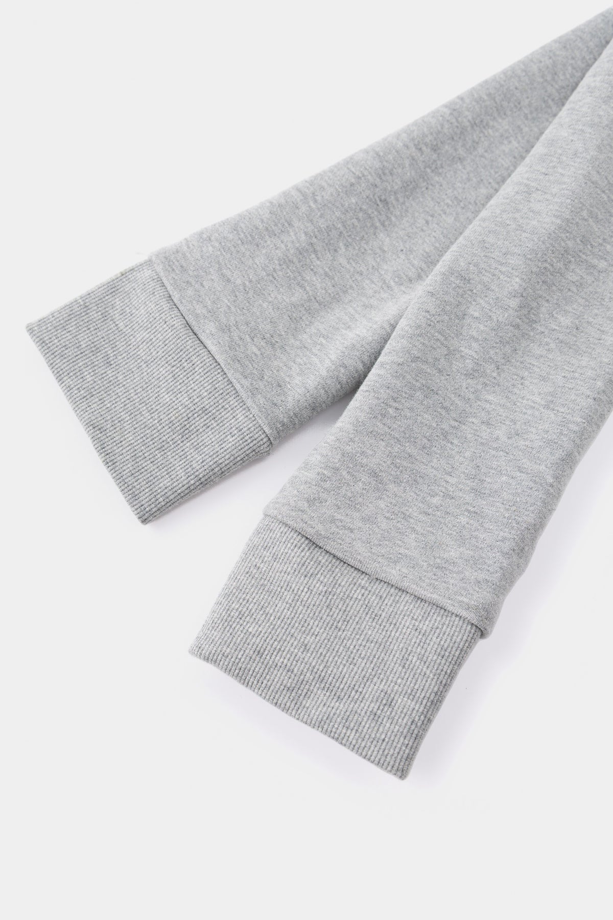 Close-up of the two ribbed cuffs where the sleeves are knotted together to form the strap.