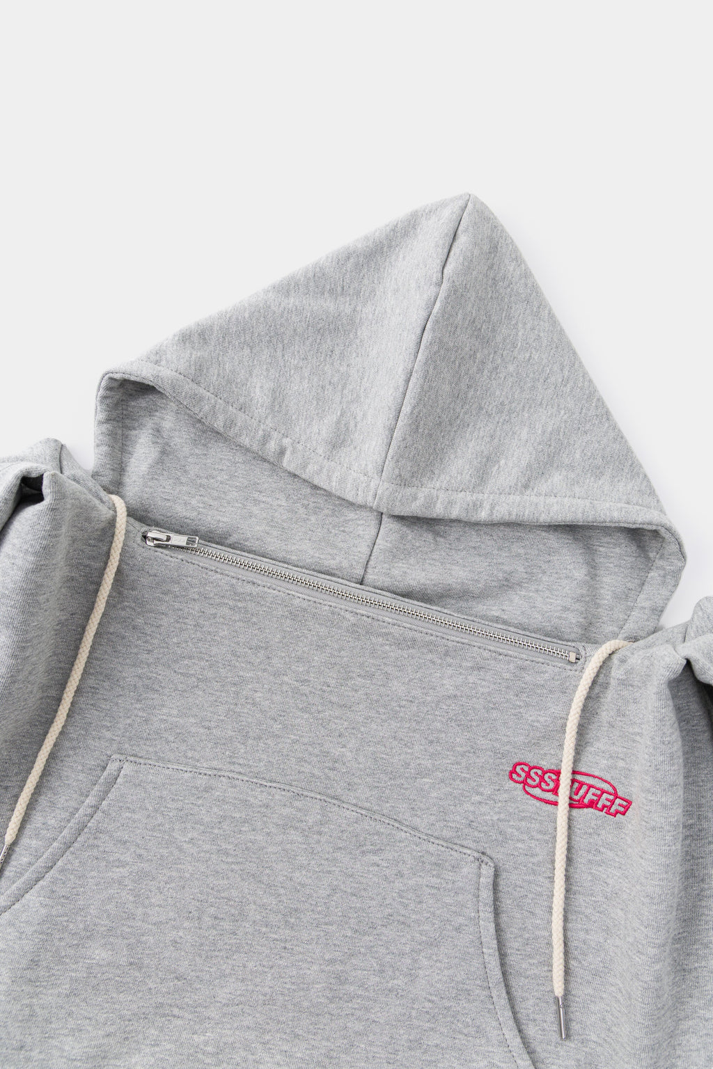 Close-up of the hood, the front zip and the natural drawcords.
