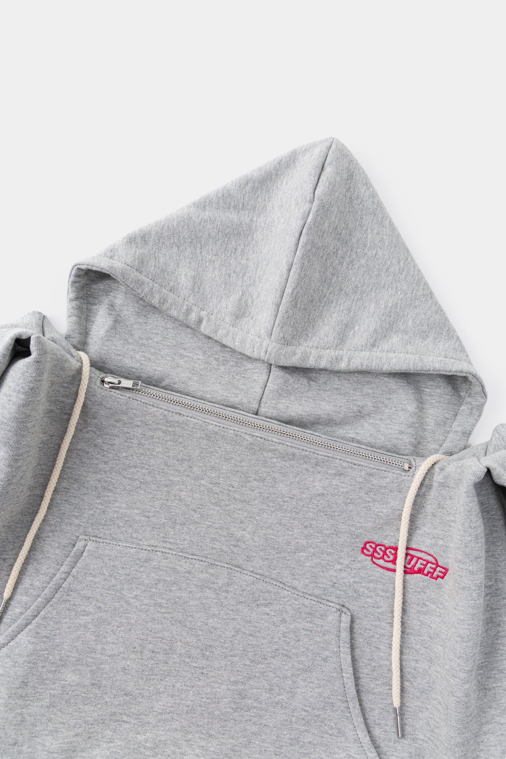 Close-up of the hood, the front zip and the natural drawcords.