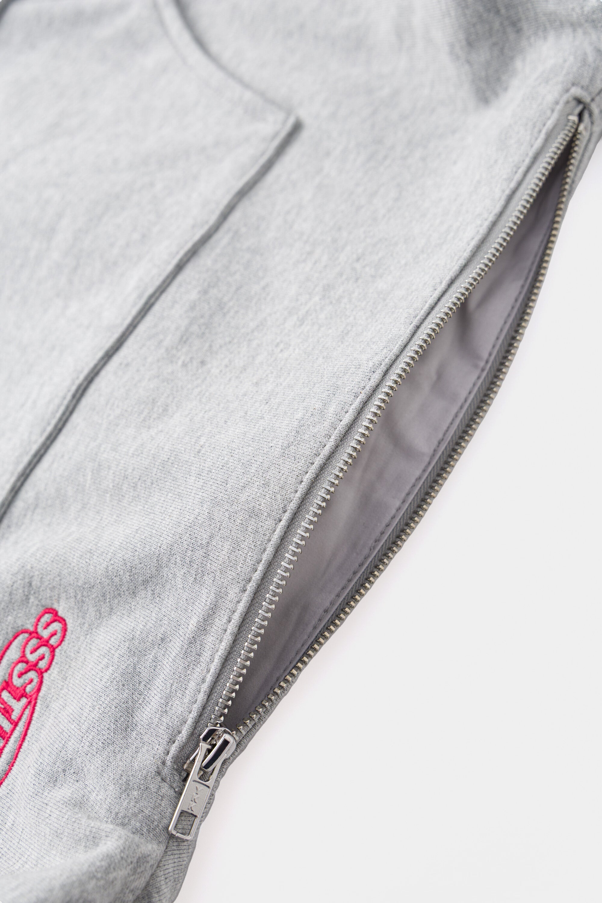 The top zip opened, showing the lined internal pocket.