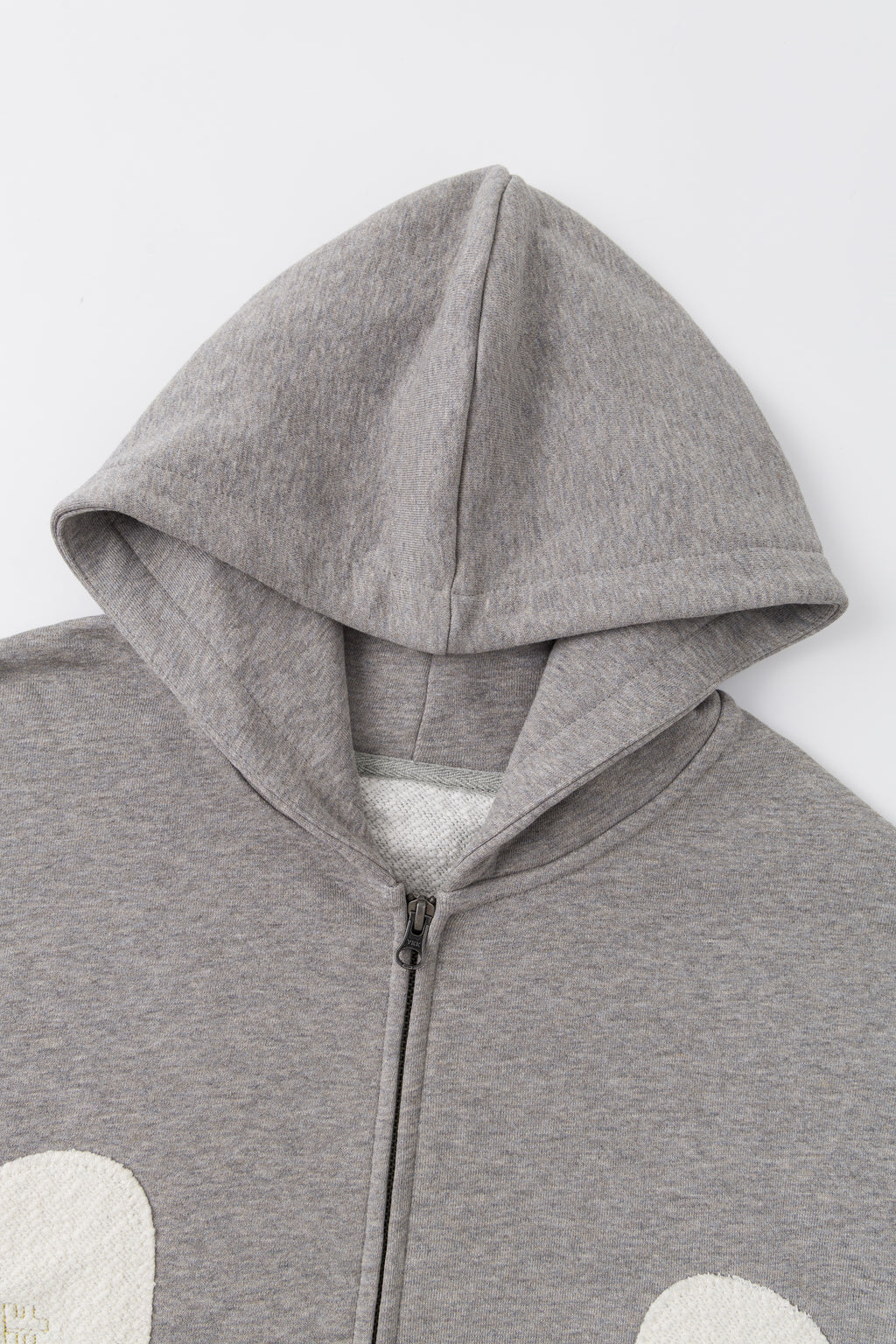 Close-up of the hood and the front zip.