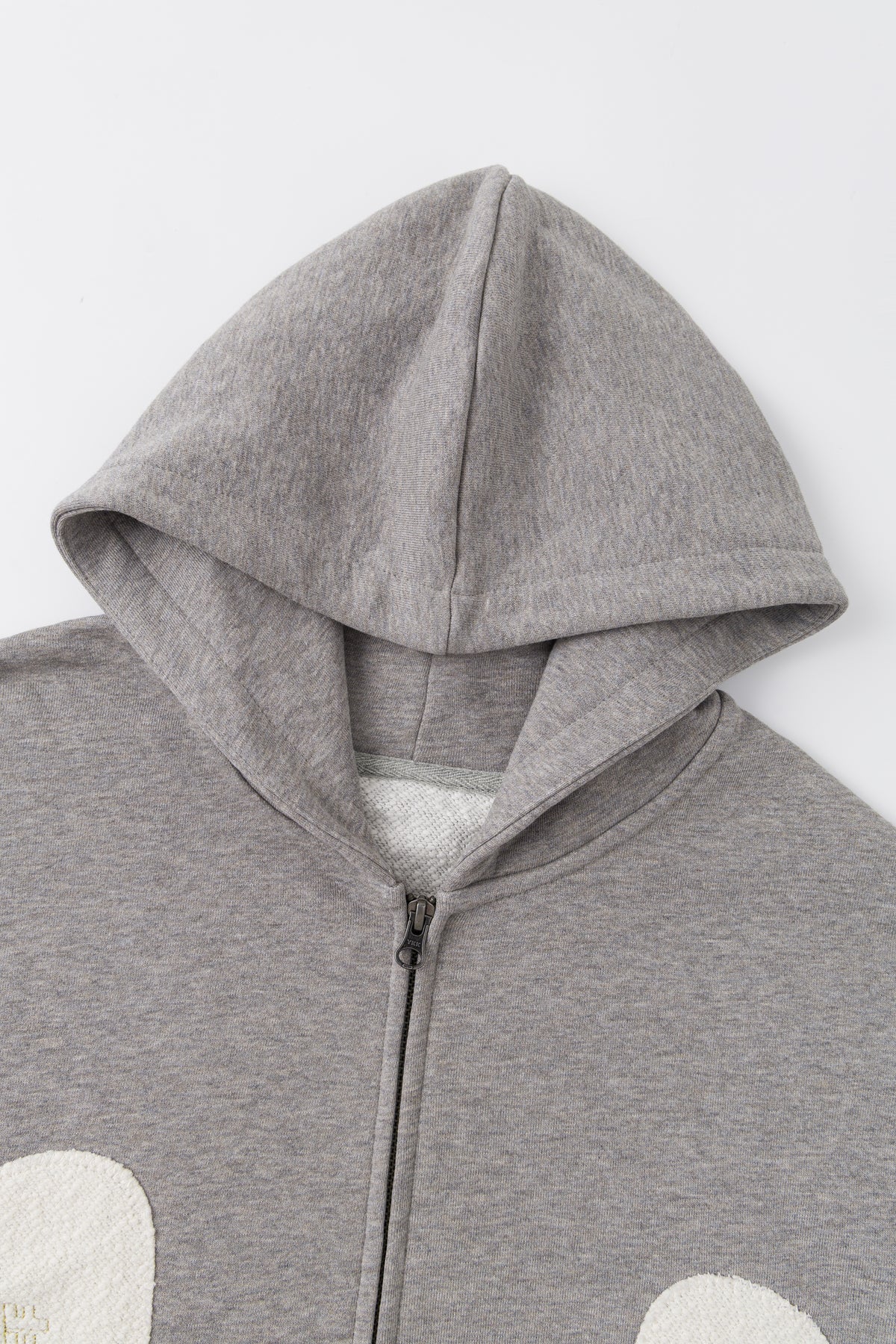 Close-up of the hood and the front zip.