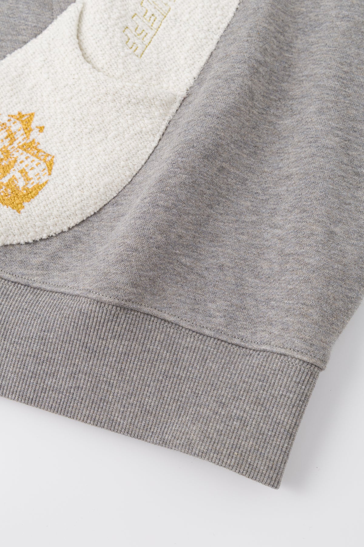 Detail of one slipper patch and the gold SSSTUFFF crest.