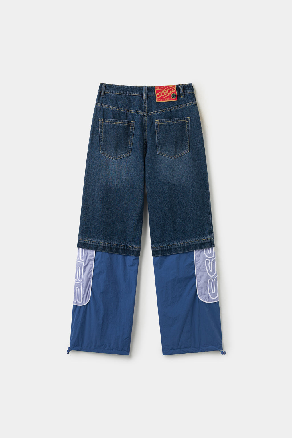 Back view of the full hybrid trackpants, denim shorts zipped to the blue nylon legs.