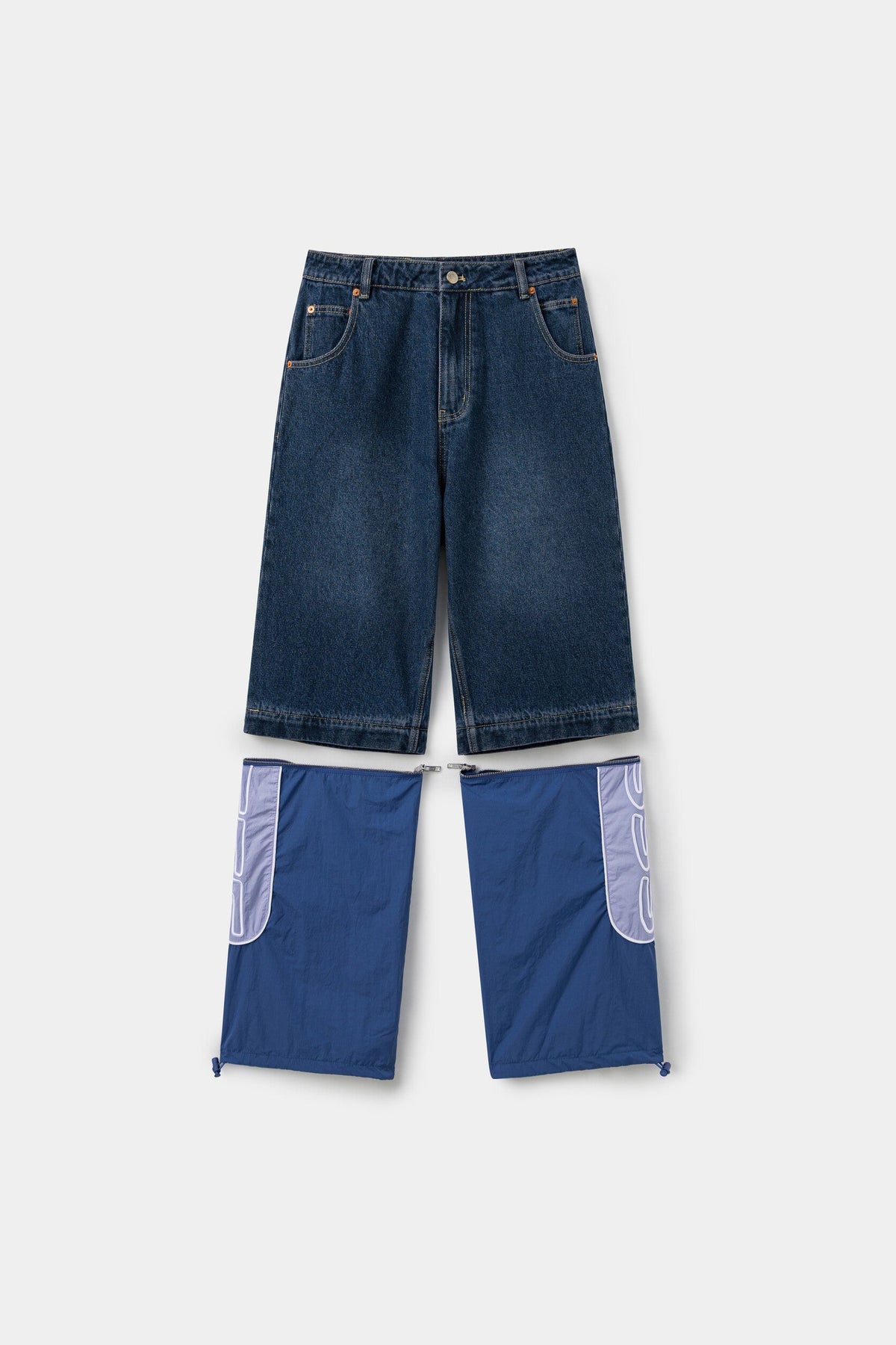 The hybrid trackpants unzipped at the knee, denim shorts above and the detachable nylon legs below.